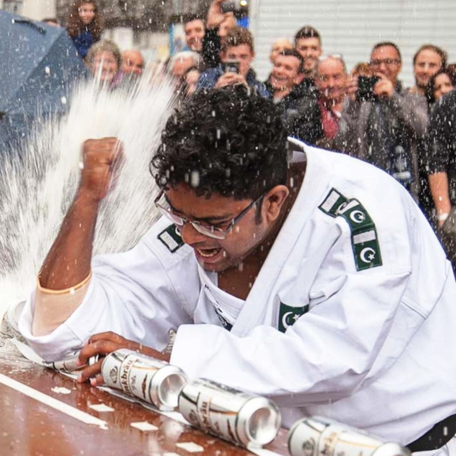 Most Drink Cans Crushed with Elbow in One Minute